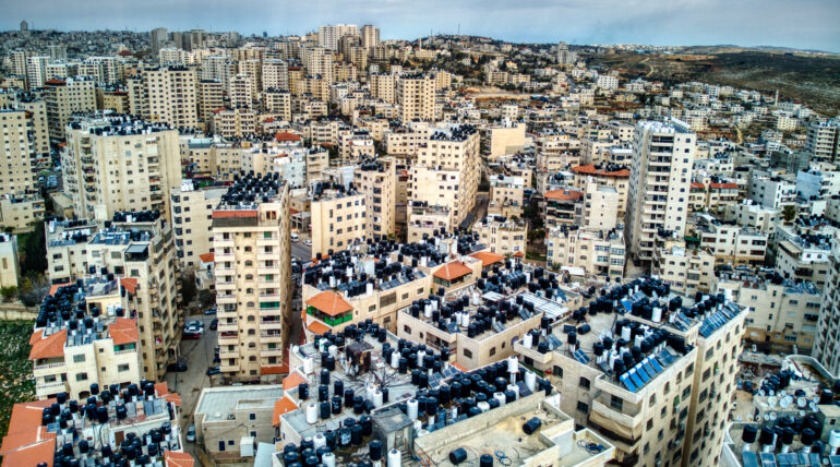 Israeli forces impose heavy fines on storeowners in Kafr Aqab and Kalandia
