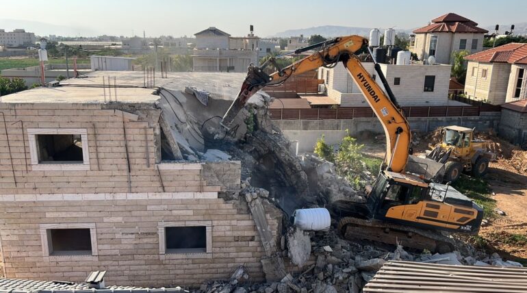 Israeli forces deliver demolition notices for two houses in East Jerusalem town of Silwan