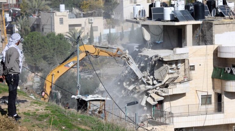 Israeli forces demolish commercial facility in East Jerusalem neighborhood of Bab Al-Amoud